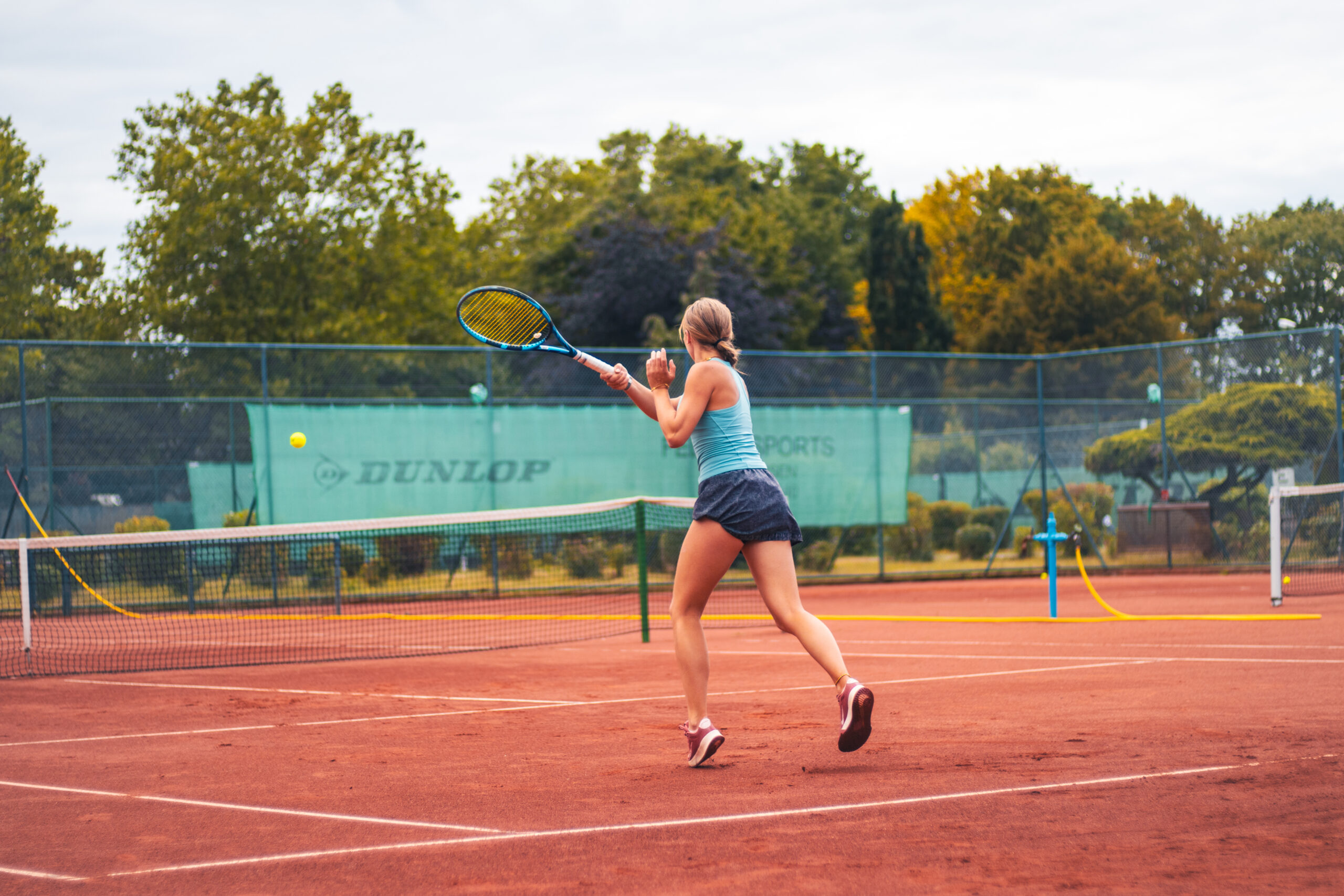 Female player at tennis court during college showcase