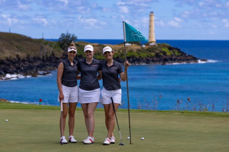 female college golf players on golf course
