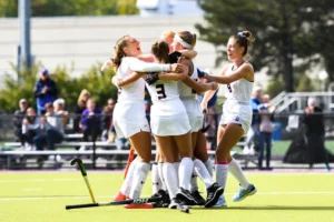 Female college athletes cheering