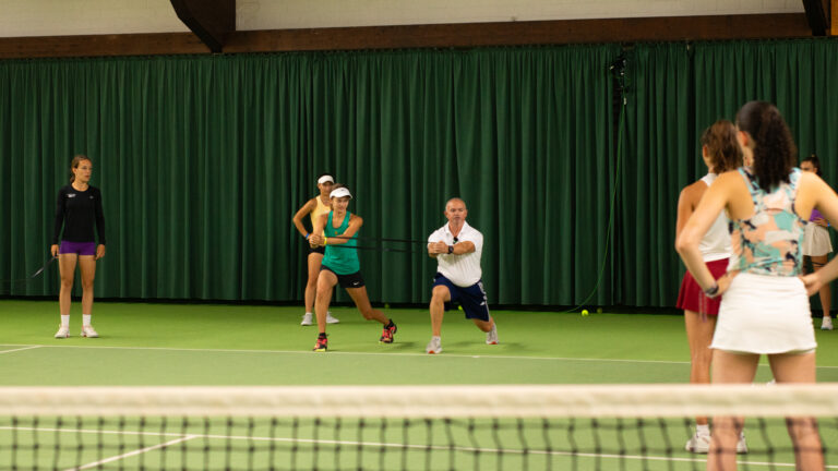 Tennis players having warm-up session with Clive Brewer