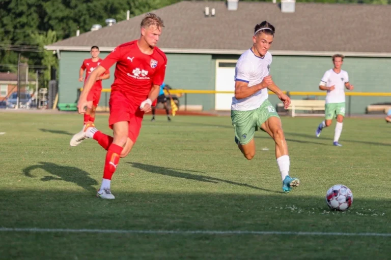 College soccer players at field during summer league