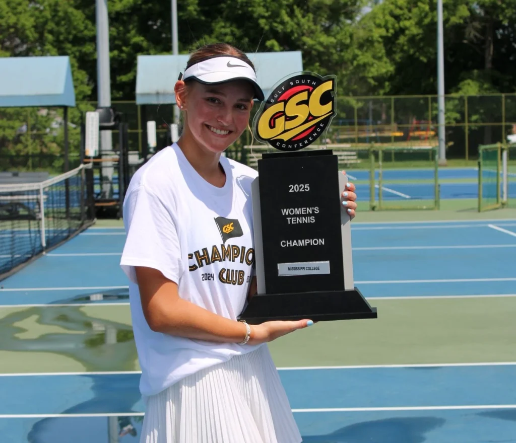 atharina Weber proudly posing with the Conference Champions trophy