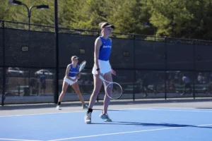 College tennis player Linn Goerdes in action during a doubles match