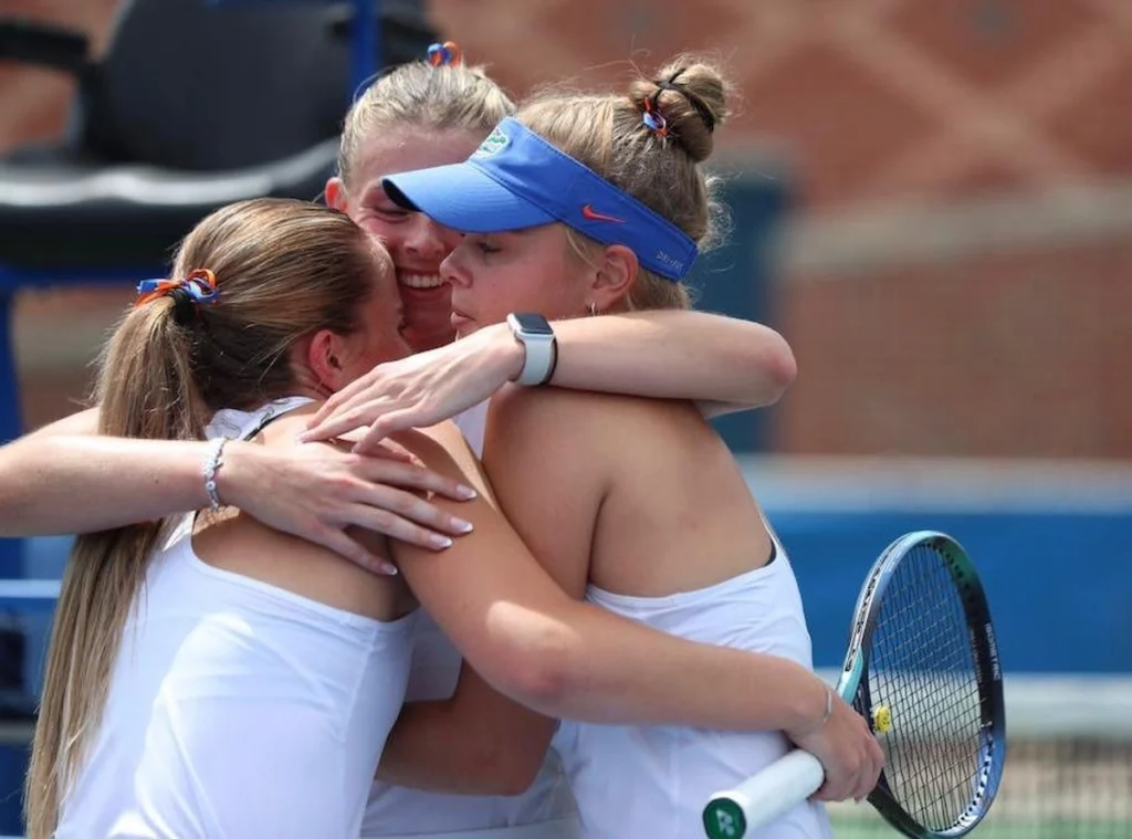 College tennis player, Sara Dahlstorm, hugging her teammates.