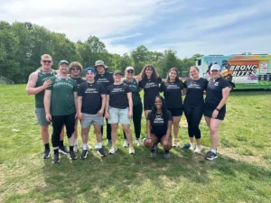 Thea Dahl with her Manhattan University track and field team