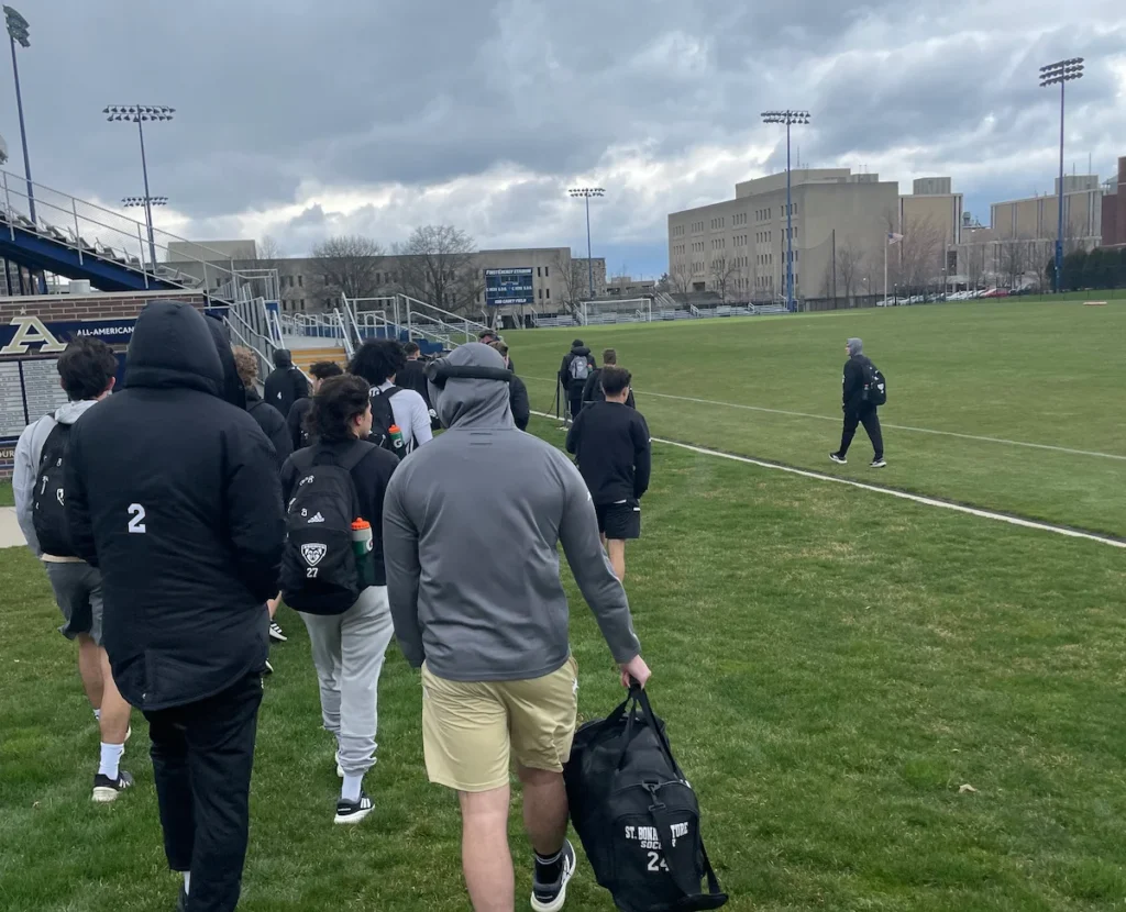 Soccer player walking to the field