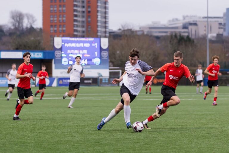 Soccer players competing for control of the ball