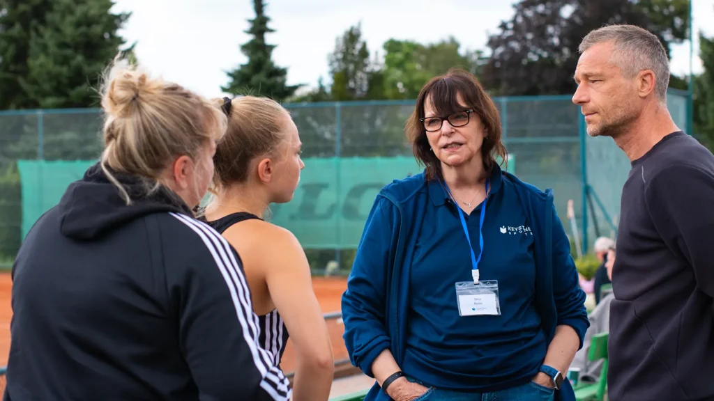 Keystone Staff talking to parents and athlete.