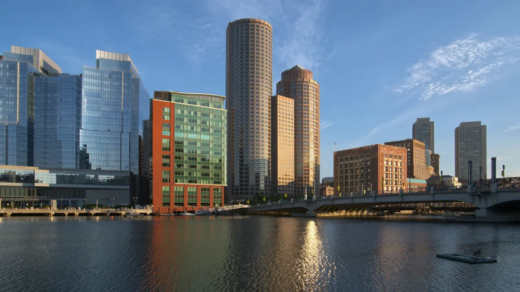 Boston buildings near the water. Photo by Pix Tresa on Unsplash