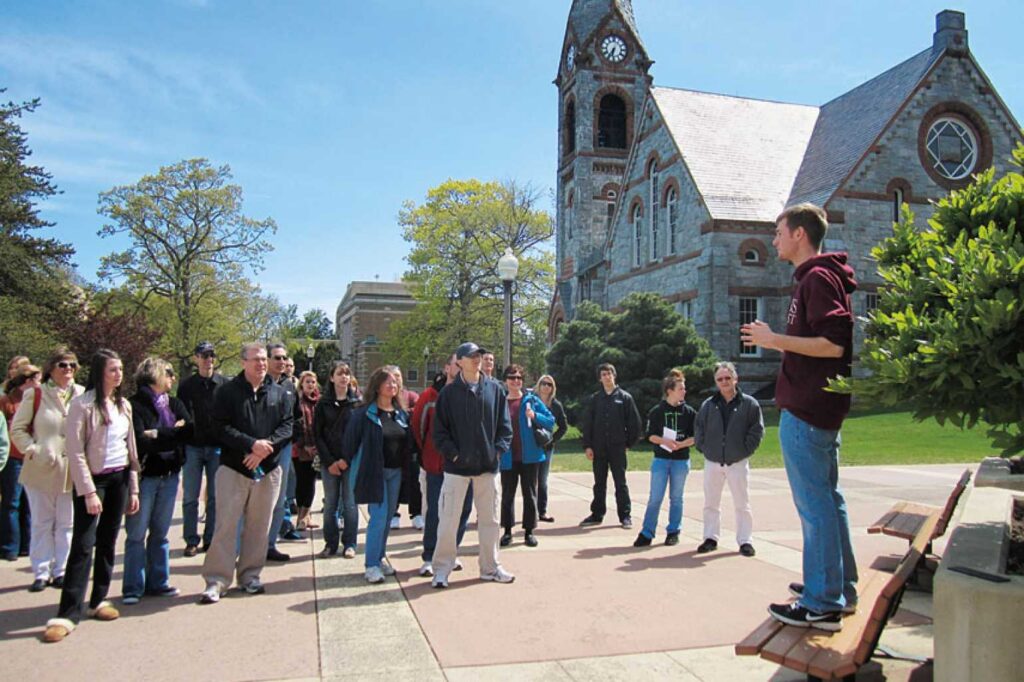 Tour guide in front of a building